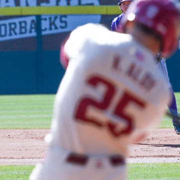 Arkansas shortstop Wehiwa Aloy on the bases against Portland with his brother Kuhio at the plate. The Razorbacks won game 3 of the series 5-3. 