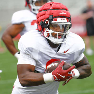 Arkansas Razorbacks running back Braylen Russell takes off during spring practice drills inside Razorback Stadium.