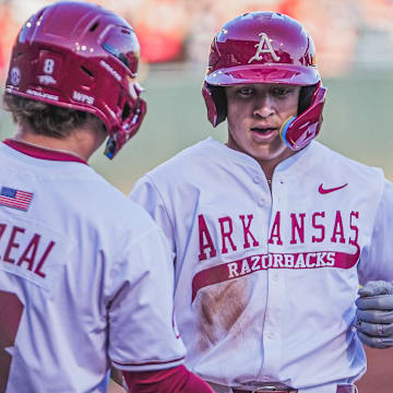 Arkansas Razorbacks designated hitter Kuhio Aloy crosses home after a homer against UCA at Baum-Walker Stadium in Fayetteville, Ark.