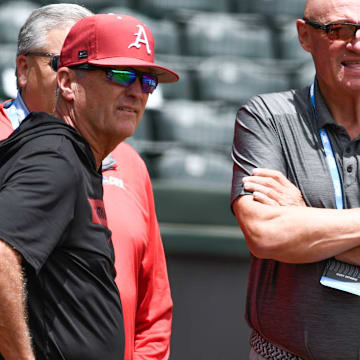 Arkansas Razorbacks coach Dave Van Horn visiting with national media at practice for the Super Regional against the Tennessee Volunteers at Baum-Walker Stadium in Fayetteville, Ark.