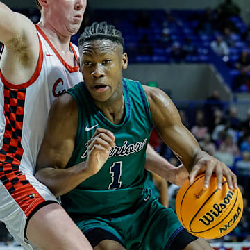 New Arkansas Razorback offer JJ Andrews from Little Rock Christian drives in the lane in the Class 4A state championship game in March at Hot Springs against the Farmington Cardinals.