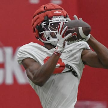Arkansas Razorbacks wide receiver O'Mega Blake makes a catch in fall camp practices at the indoor center in Fayetteville, Ark.