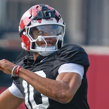 Arkansas Razorbacks quarterback Taylen Green prepares to throw during preseason drills on the outdoor practice fields in Fayetteville, Ark.