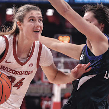 Arkansas Razorbacks Jenna Lawrence drives to the basket against the UCA Sugar Bears in a game at Bud Walton Arena in Fayetteville, Ark.