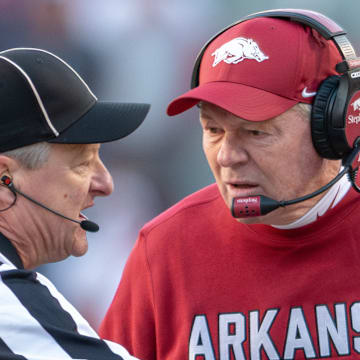Arkansas Razorbacks coach Bobby Petrino talking to official during game against the Mississippi State Bulldogs at Razorback Stadium in Fayetteville, Ark.