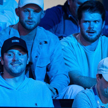 Buffalo Bills quarterback Josh Allen, bottom left, and Minnesota Vikings quarterback Sam Darnold, top right, attend the TGL match between Jupiter Links GC and Atlanta Drive GC at SoFi Center on March 4, 2025, in Palm Beach Gardens, Florida.