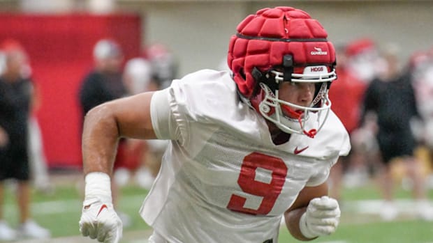 Razorbacks tight end Luke Hasz runs a pass route at practice indoors.