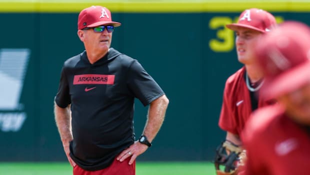Razorback coach Dave Van Horn working with the infielders during practice before the Super Regional against Tennessee