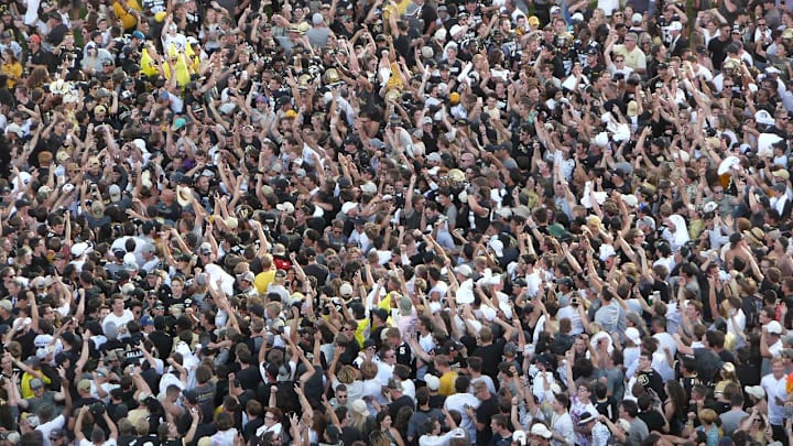 Colorado fans stormed the field after wins over Nebraska in 2019 (above) and 2023. Should Nebraska fans return the favor Saturday night if the Huskers beat the Buffs?