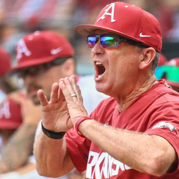 Arkansas Razorbacks coach Dave Van Horn yells from the dugout in a game against the Florida Gators on April 27, 2024, at Baum-Walker Stadium in Fayetteville, Ark.
