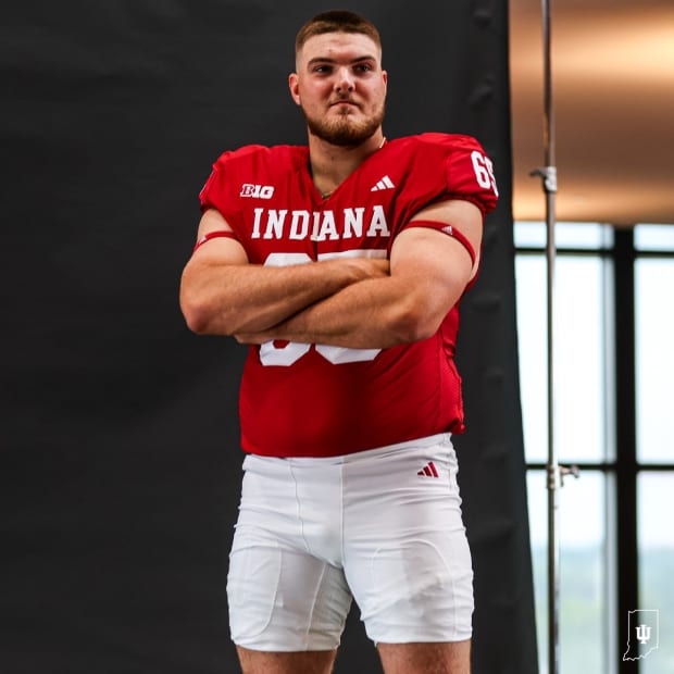 Offensive lineman Carter Smith wears Indiana's new football uniforms during a photoshoot.