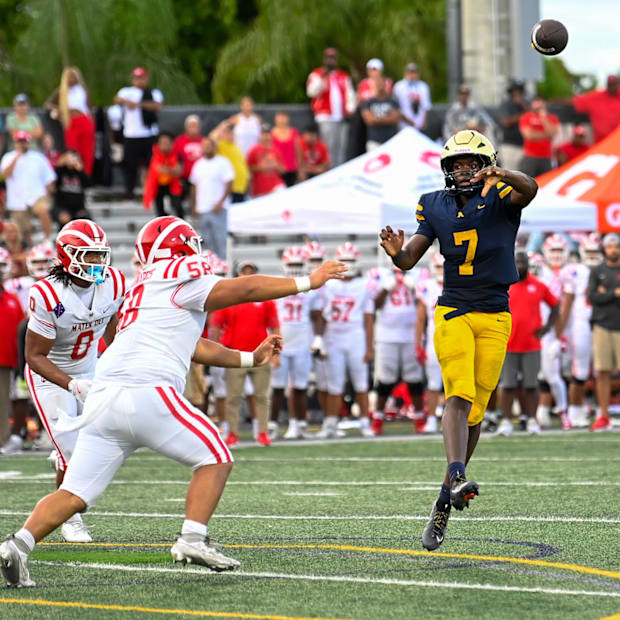 St. Thomas Aquinas quarterback Mason Mallory (7) evades the pass rush of top-ranked Mater Dei to deliver a pass.