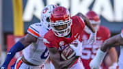 Arkansas Razorbacks wide receiver Andrew Armstrong hauls in a pass from KJ Jefferson against the Auburn Tigers in November 2023 in a game at Razorback Stadium in Fayetteville, Ark.