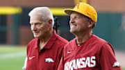 Former Arkansas Razorbacks coach Norm DeBriyn and current coach Dave Van Horn at a game on April 30, 2024, at Baum-Walker Stadium.