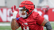 Arkansas Razorbacks defensive lineman Cam Ball during drills at summer practice Wednesday on the outdoor practice field in Fayetteville, Ark.
