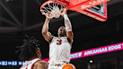 Arkansas Razorbacks Adou Thiero finishes off a dunk against the Pacific Tigers at Bud Walton Arena in Fayetteville, Ark.
