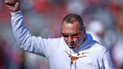 Texas Longhorns coach Steve Sarkisian during pregame warmups before game with the Arkansas Razorbacks at Razorback Stadium in Fayetteville, Ark.