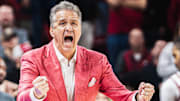 Arkansas Razorbacks coach John Calipari reacts to a made shot against the Georgia Bulldogs in a 68-65 comeback win Wednesday night at Bud Walton Arena in Fayetteville, Ark.