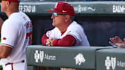 Arkansas Razorbacks coach Dave Van Horn in the dugout against the Charlotte 49ers at Baum-Walker Stadium in Fayetteville, Ark.