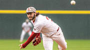 Arkansas Razorbacks pitcher Zach Root delivers a throw to the plate against the Missouri Tigers at Baum-Walker Stadium in Fayetteville, Ark.