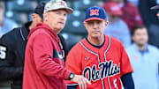 Arkansas Razorbacks coach Dave Van Horn and Ole Miss Rebels coach Mike Bianco meeting at home plate before a game in 2024 at Baum-Walker Stadium in Fayetteville, Ark.