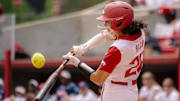 Arkansas Razorbacks shortstop Atalyia Rijo takes a swing against the Ole Miss Rebels in the NCAA Super Regional at Bogle Park in Fayetteville, Ark.