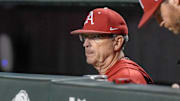 Arkansas Razorbacks coach Dave Van Horn in the dugout during a game with the Texas Longhorns at Baum-Walker Stadium in Fayetteville, Ark.