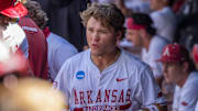 Arkansas Razorbacks' Cam Kozeal in dugout in an NCAA Regional game against the North Dakota State Bison at Baum-Walker Stadium in Fayetteville, Ark.