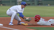 Arkansas Razorbacks shortstop Wehiwa Aloy comes up short on a slide into third base against the Creighton Bluejays in the NCAA Regional