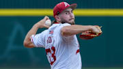 Arkansas Razorbacks Zach Root throws to the plate against the Tennessee Volunteers in Super Regional game at Baum-Walker Stadium in Fayetteville, Ark.