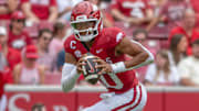 Arkansas Razorbacks quarterback Taylen Green scrambling looking to pass in a game against the Alabama A&M Bulldogs at Razorback Stadium in Fayetteville, Ark.