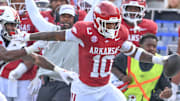 Arkansas Razorbacks linebacker Xavian Sorey running after an interception against the Arkansas State Red Wolves at War Memorial Stadium in Little Rock, Ark.