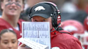 Arkansas Razorbacks coach Bobby Petrino looks over his notes during game with the Auburn Tigers at Razorback Stadium in Fayetteville, Ark.
