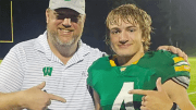 West Davidson Booster Club President Andrew Ward and sophomore quarterback Carson Correll point to each other following the Green Dragons' 35-0 victory over rival Leddford on Friday night. The win staked the team to its first 2-0 start since 2010.