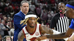 Kentucky's John Calipari watching El Ellis drive against the Wildcats in January.