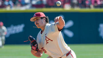 Arkansas Razorbacks pitcher Landon Beidelschies delivers a pitch against the Portland Pilots at Baum-Walker Stadium in Fayetteville, Ark.