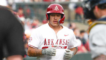 Arkansas Razorbacks shortstop Kuhio Aloy leads off second base in game against Oral Roberts at Baum-Walker Stadium in Fayetteville, Ark.