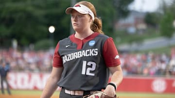 Arkansas Razorbacks pitcher Payton Burnham walks to the dugout after getting the Ole Miss Rebels out in an NCAA Super Regional at Bogle Park
