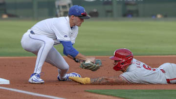 Arkansas Razorbacks shortstop Wehiwa Aloy comes up short on a slide into third base against the Creighton Bluejays in the NCAA Regional