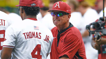 Arkansas Razorbacks coach Dave Van Horn greeting players before facing the Tennessee Volunteers in an NCAA Super Regional in Fayetteville, Ark.