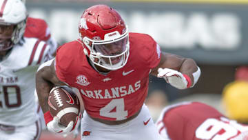 Arkansas Razorbacks running back Mike Washington runs against the Alabama A&M Bulldogs at Razorback Stadium in Fayetteville, Ark.