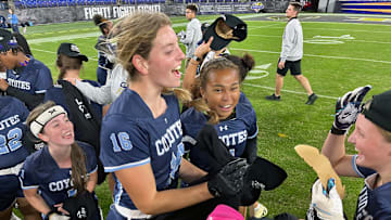 Clarksburg flag football players celebrate their victory over Boonsboro after the finals of Maryland's first girls flag football state championship, hosted by the Baltimore Ravens at M&T Bank Stadium.