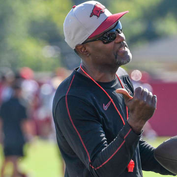 Arkansas Razorbacks secondary coach Marcus Woodson at practice Friday on the outdoor fields in Fayetteville, Ark.
