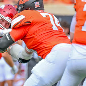 Arkansas Razorbacks Anton Juncaj rushing the passer against Oklahoma State.