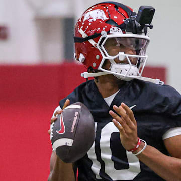 Arkansas Razorbacks quarterback Taylen Green with his VR camera at the team's first practice in Fayetteville, Ark.