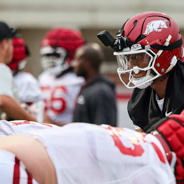 Arkansas Razorbacks quarterback Taylen Green with his VR camera at the team's first practice in Fayetteville, Ark.
