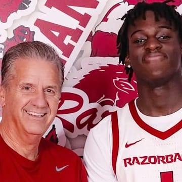 Arkansas Razorbacks coach John Calipari with Abdou Toure on a recruiting visit in Fayetteville, Ark.
