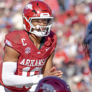 Arkansas Razorbacks quarterback Taylen Green looking over the Mississippi State Bulldogs' defense before a snap in a game at Razorback Stadium in Fayetteville, Ark.