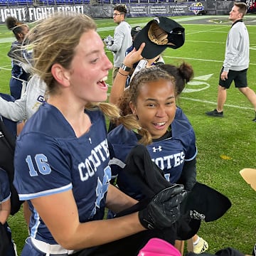 Clarksburg flag football players celebrate their victory over Boonsboro after the finals of Maryland's first girls flag football state championship, hosted by the Baltimore Ravens at M&T Bank Stadium.
