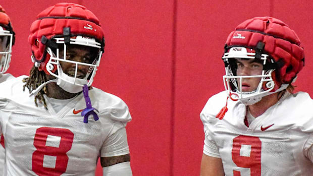 Razorbacks tight ends Ty Washington and Luke Hasz at Thursday's practice.